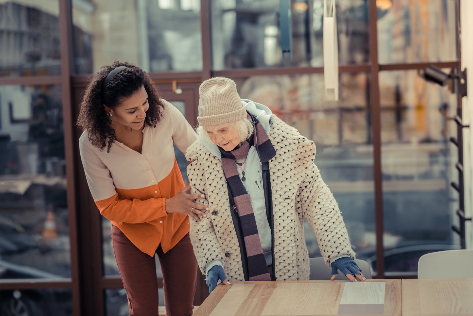 Positive friendly young woman showing her kindness