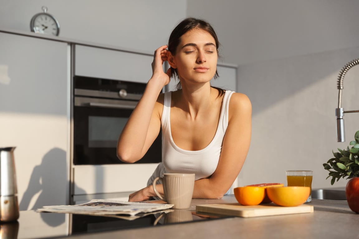 Healthy Woman in the Kitchen Standing Daily Morning Routine.