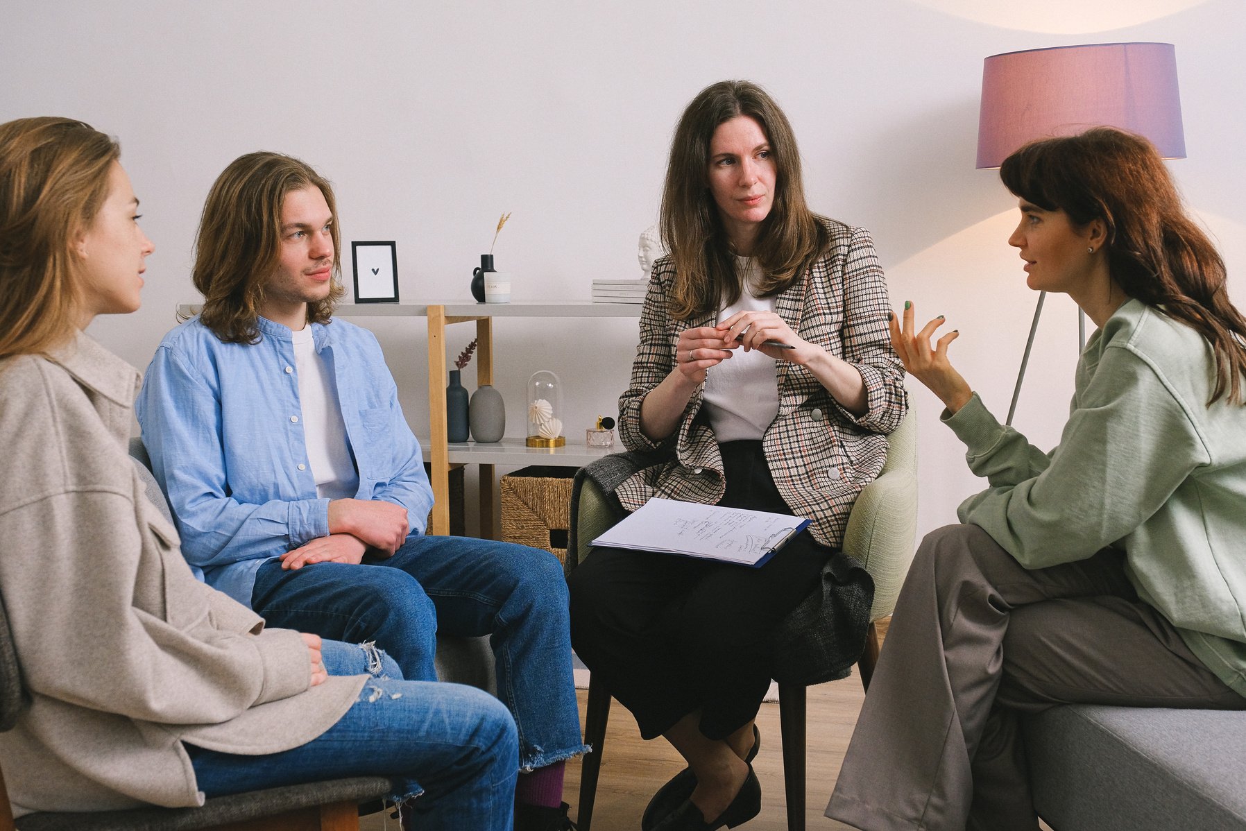 Woman discussing problem during group therapy