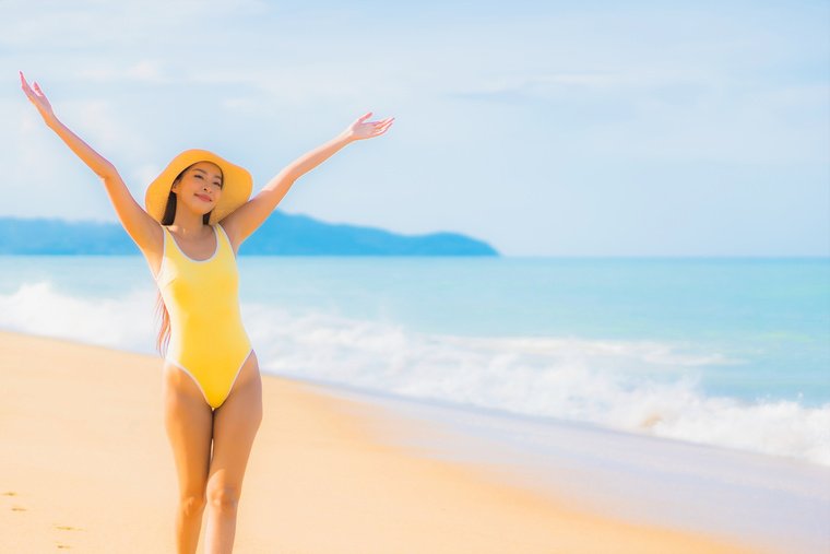 Asian Woman Relax Smile Leisure around Beach