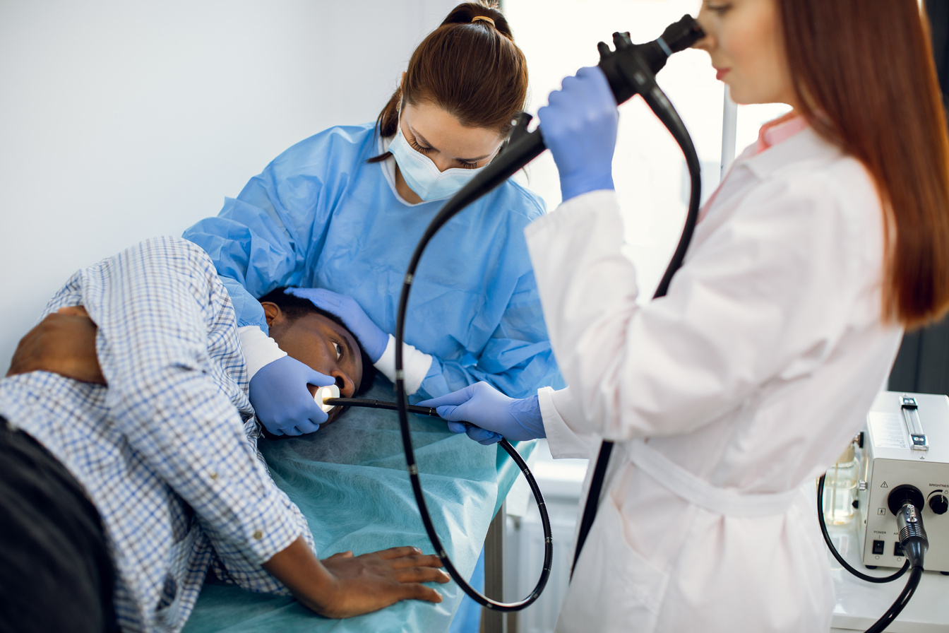 Male African patient having endoscopy in modern clinic.